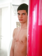 Brunette twink shows his long cock