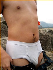 Cute Japanese guy gets naked on the beach