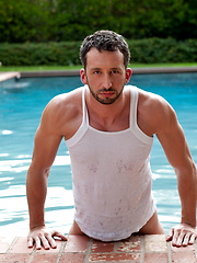 Hot hunk posing by the pool