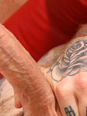 Alternative guy with tattoed and pierced body