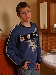 Little teen boy plays with his big cock