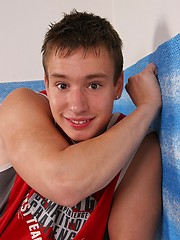 Athletic teen boy undress his shirt and pants