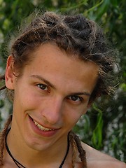 Young rasta boy relaxing in the garden