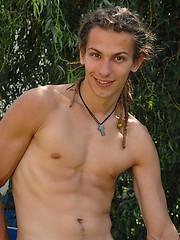 Young rasta boy relaxing in the garden