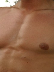 Muscled european stud posing outdoors