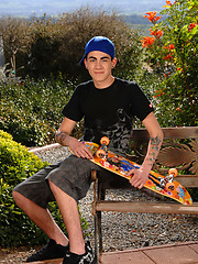 Skater boy in outdoor softcore scene