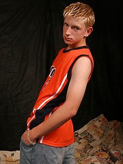 Blond twink strokes dick