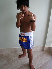 16 photos of cute gay Thai kickboxer posing and stripping