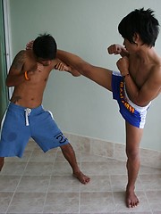 16 photos of cute gay Thai kickboxer posing and stripping