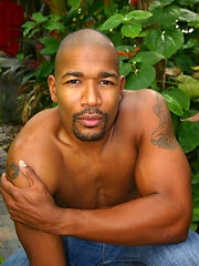 Black man posing by the pool