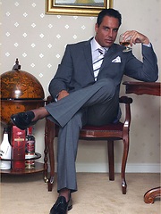 Hunky office guy relaxing after hard work day