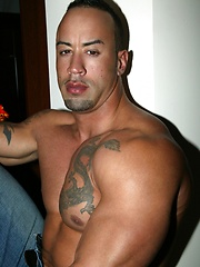 Big muscled latin dude posing before camera
