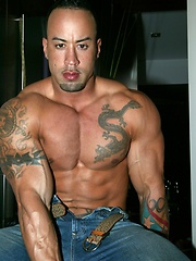 Big muscled latin dude posing before camera