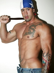 Big muscled latin dude posing before camera