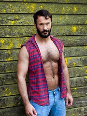 Muscled guy with hairy chest bares his sexy body