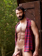 Muscled guy with hairy chest bares his sexy body