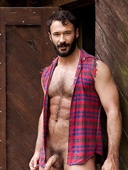 Muscled guy with hairy chest bares his sexy body