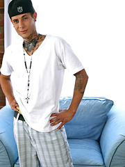 Sexy beefy jock with tattoed chest takes off his clothes