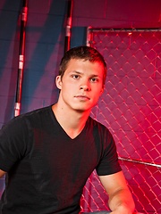 Young next door buddy posing under red lights