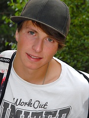 Nude skinny boy playing in the sand