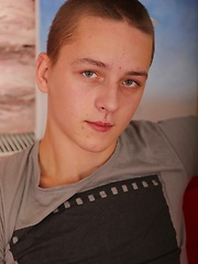 Cute college twink Thomas Swings strokes his crooked cock.