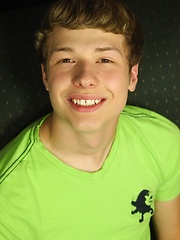 Smooth twink Levi Lee tugs on his hard cock.