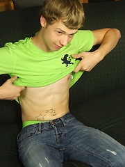 Smooth twink Levi Lee tugs on his hard cock.