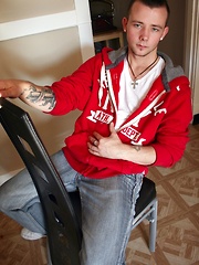 Tattooed Kyle Collins stroking his small cock.